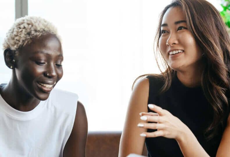 Women in the workplace talking together